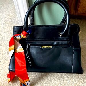 New black purse, this is a medium/small bag with lots of pockets and room